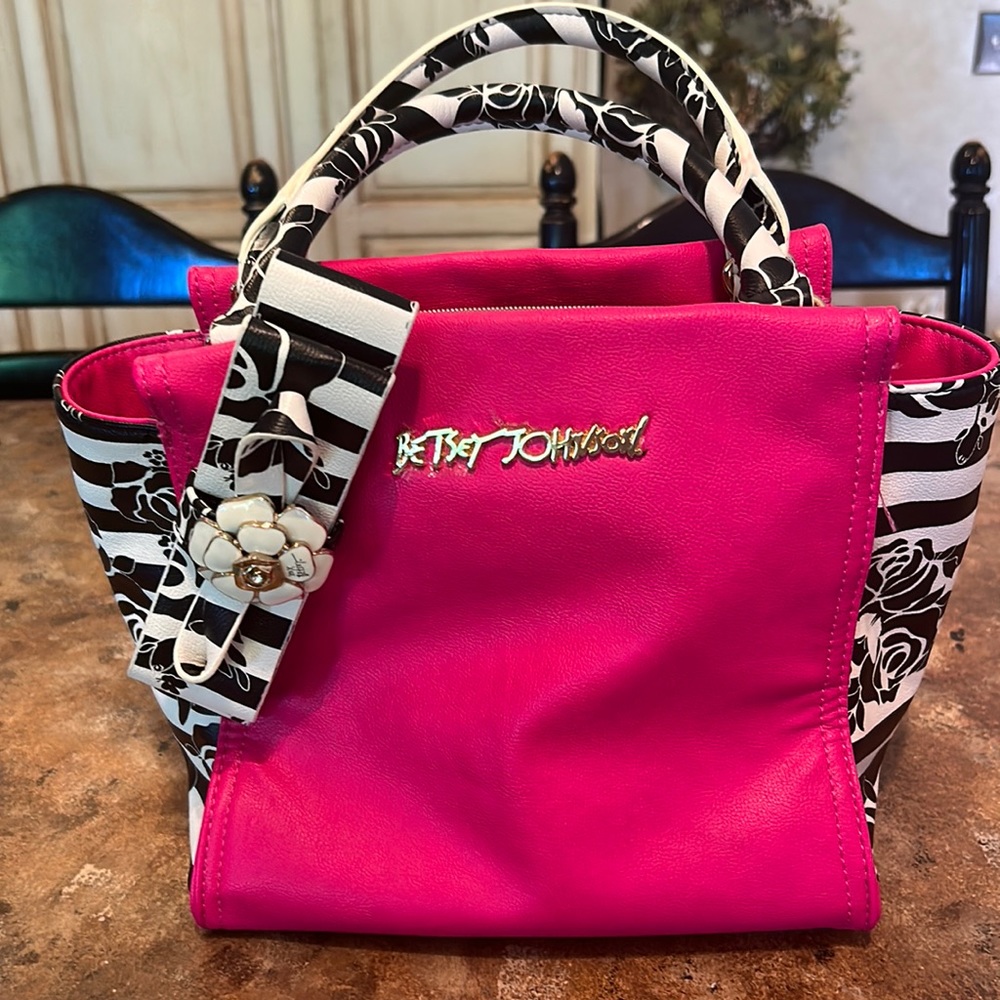 Betsey Johnson hot pink purse with black rose detail.